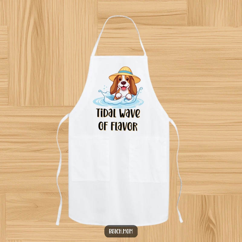 Funny Basset Hound apron featuring a dog in a sun hat joyfully splashing in a tiny wave, perfect for a humorous cooking experience.