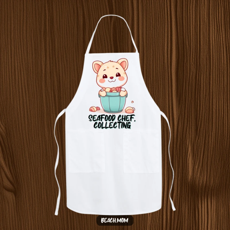 Funny apron: A smiling animal character holds a bucket full of seashells, perfect for beach-loving cooks.