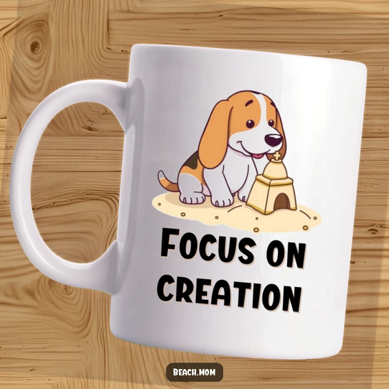 Funny Basset Hound mug shows a dog with intense focus, diligently building a tiny sandcastle at the beach.