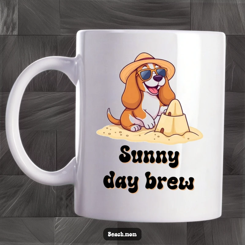 Funny Basset Hound Beach Mug: A happy Basset hound in sunglasses and sun hat builds a sandcastle, embodying beach fun, perfect funny gift.