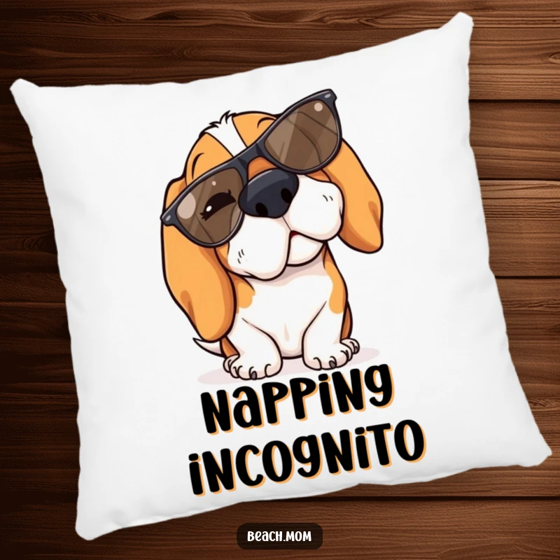 Funny Basset Hound pillow featuring a dog winking slyly while wearing cool sunglasses tipped on its nose.