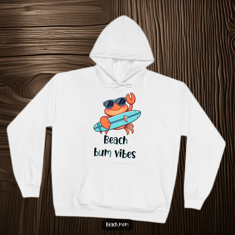 Funny crab hoodie featuring a cool crab with sunglasses and a surfboard, embodying humorous beach relaxation and surf culture.