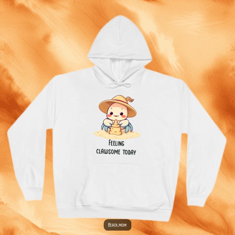 Funny Kawaii Crab Hoodie: a sweet crab in a sun hat diligently working on a sandcastle, ready for cool weather.