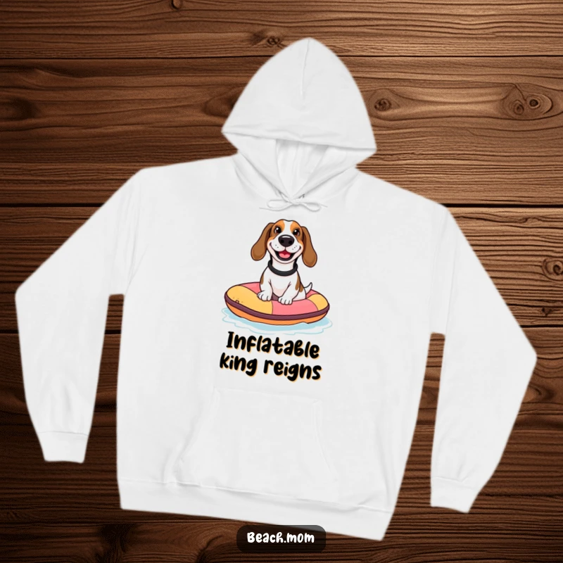 Funny Basset Hound hoodie featuring a dog with a goofy grin riding a tiny inflatable raft, perfect for cozy, humorous relaxation.