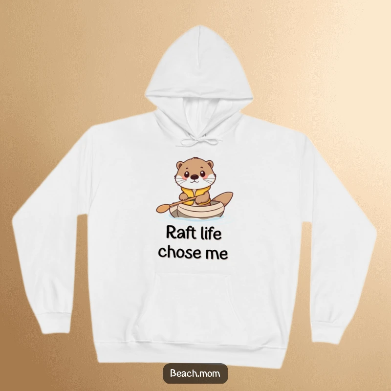 Funny hoodie with a cute otter in a life vest, bravely paddling a miniature raft, designed for comfort and smiles.