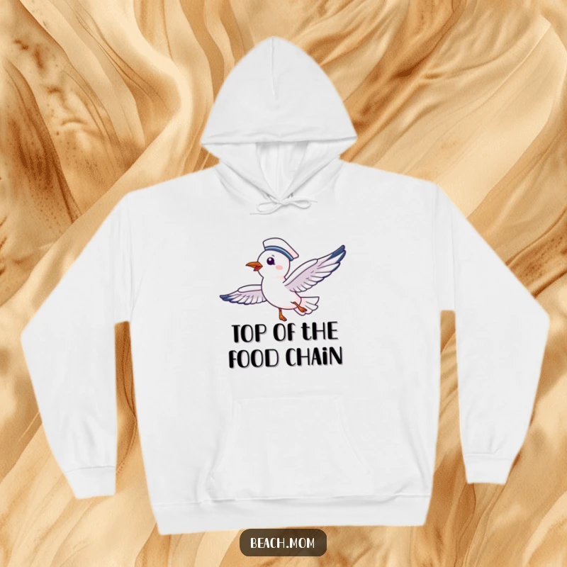 Funny hoodie depicting a delighted seagull in a sailor's hat, soaring gleefully, ready for any nautical escapade.