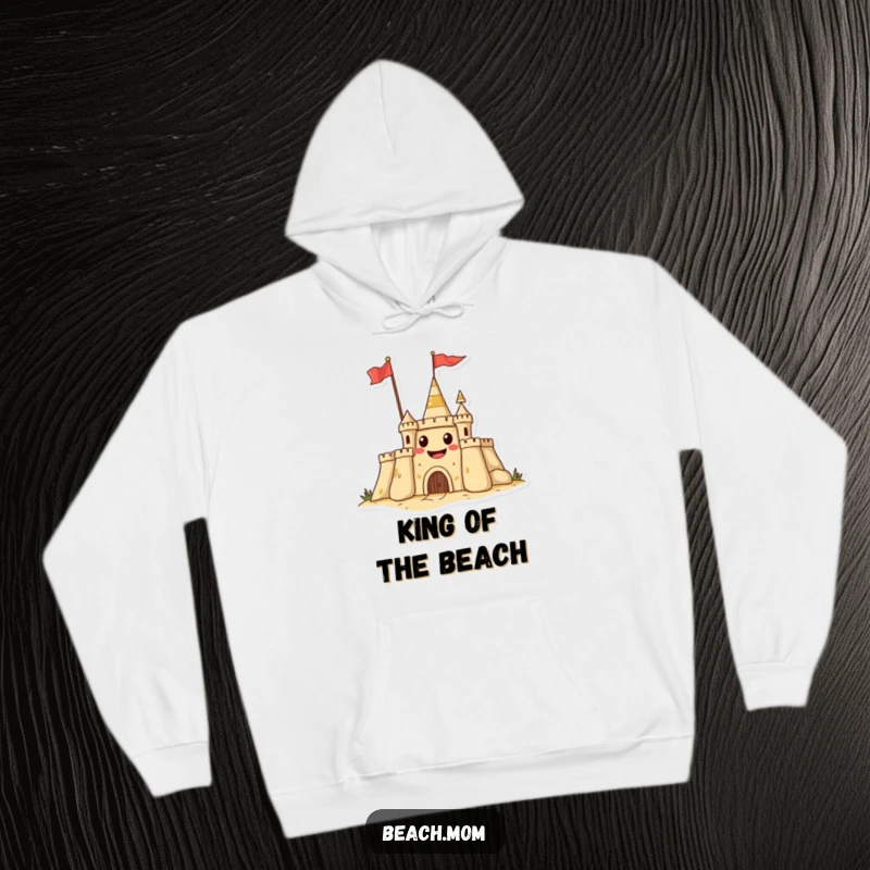 Funny hoodie featuring a grinning sandcastle waving a flag, offering warmth and a touch of beach humor.
