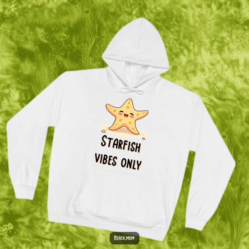 Funny hoodie showcasing a happy starfish wiggling its arms on the beach, offering warmth and a dose of fun.
