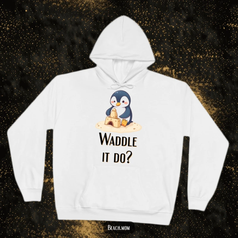 Funny penguin with small flippers building a sandcastle, depicted on a warm hoodie, conveying a charming and humorous beach scene.
