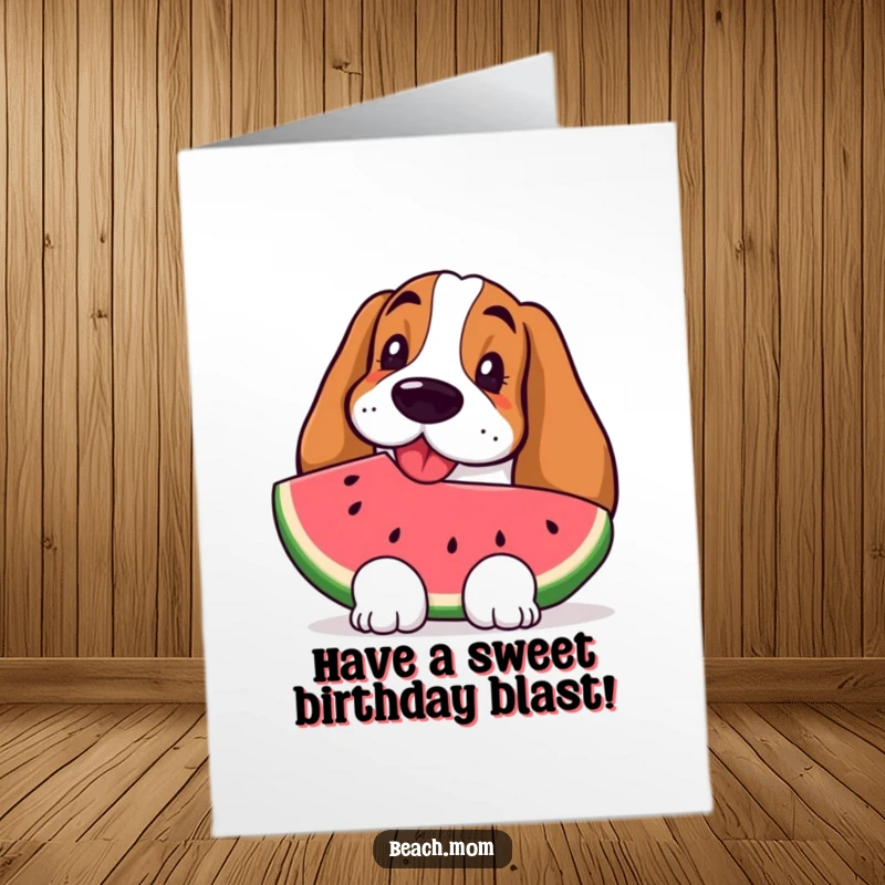 Free Printable Birthday Card: A happy Basset Hound looks refreshed, holding a juicy watermelon slice.