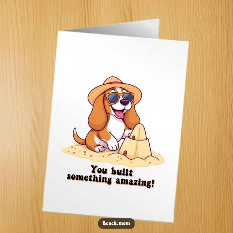 Funny Free Printable Congratulations Card showing a Basset Hound with sunglasses building a sandcastle, a delightful downloadable gift.