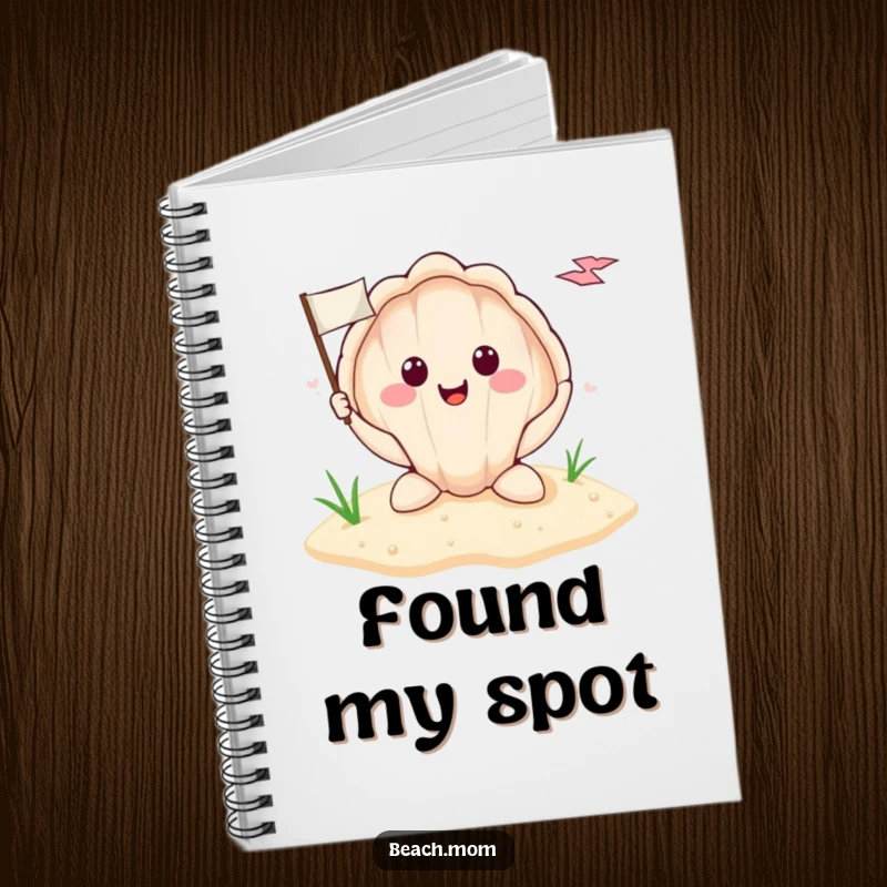 Funny smiling seashell holding a tiny flag planted in the sand, featured on a notebook cover, encouraging coastal journaling.