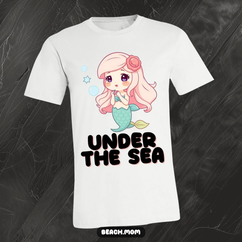 Funny t-shirt showcasing a happy mermaid with shell accessories, blowing shimmering bubbles, perfect for ocean fantasy fans.